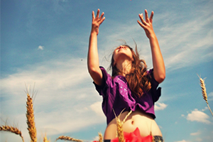 Girl throwing flower petals in the air