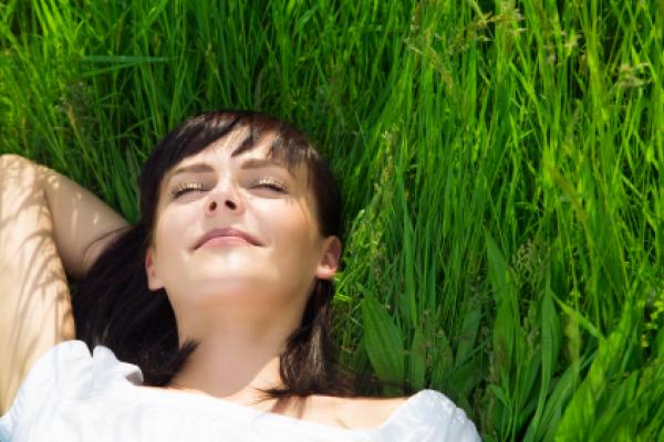 Girl lying in grass