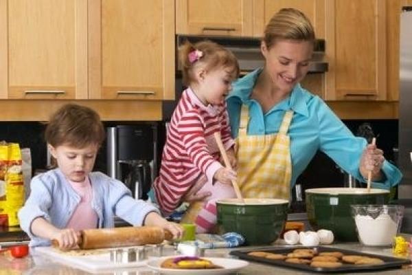 Woman cooking with her kids