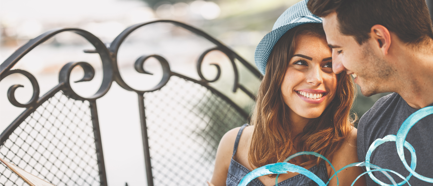 woman in blue hat smiling